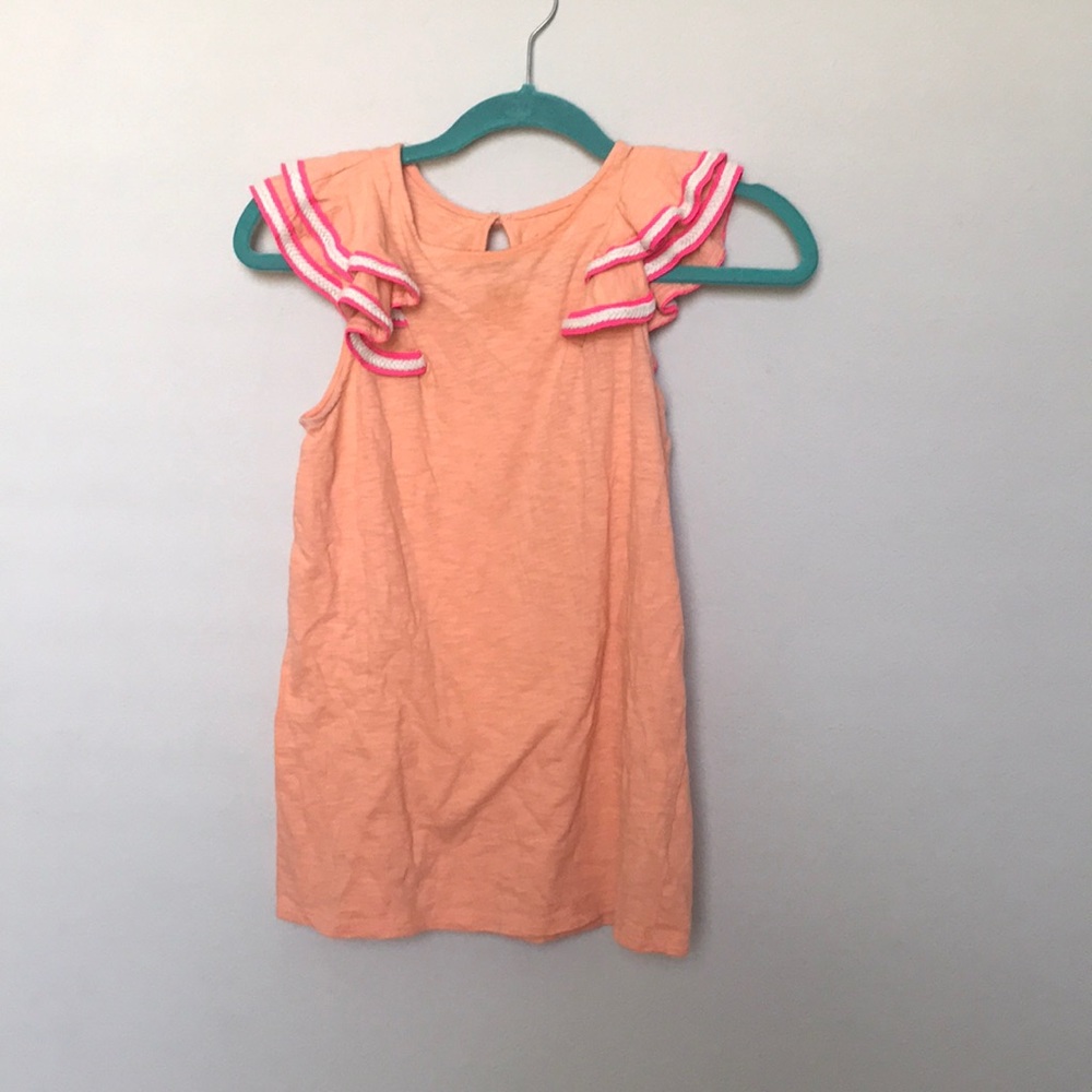 Pink shirt with the ruffles on items rope detail